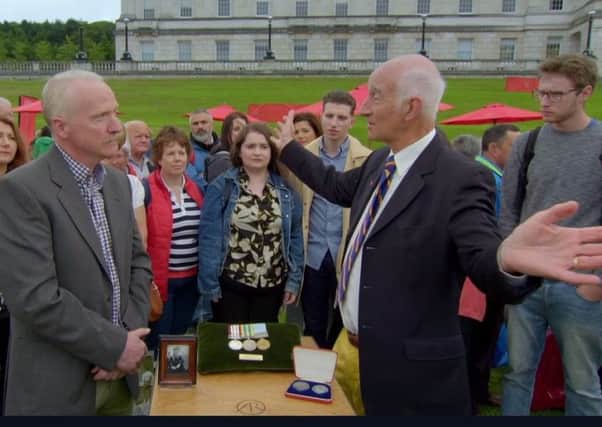 Andrew Bannister, participant in Antiques Roadshow, aired on 23-09-18, at Stormont. The man to the right gesturing is Paul Atterbury from the show
. C/O BBC.