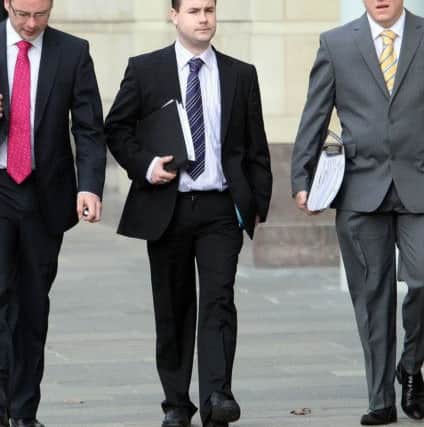 Chris Ward (centre), 26, from Colinmill, Poleglass, arrives at Belfast Crown Court in 2008 where he denied charges in relation to the Northern Bank robbery,  and two further charges of false imprisonment.
 He was acquitted of all charges. Colm O'Reilly Pacemaker Press