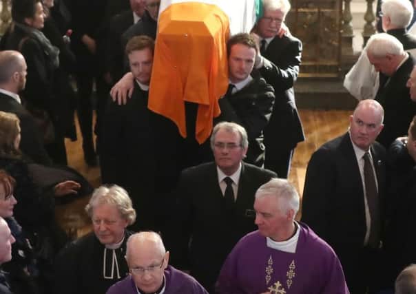 The coffin of Martin McGuinness is carried out of at St Columba's Church Long Tower, in Londonderry in March 2017. "How the former IRA leader got state funeral honours in a Catholic church is a story yet to be told," writes Shane Paul O'Doherty. Photo: Niall Carson/PA Wire