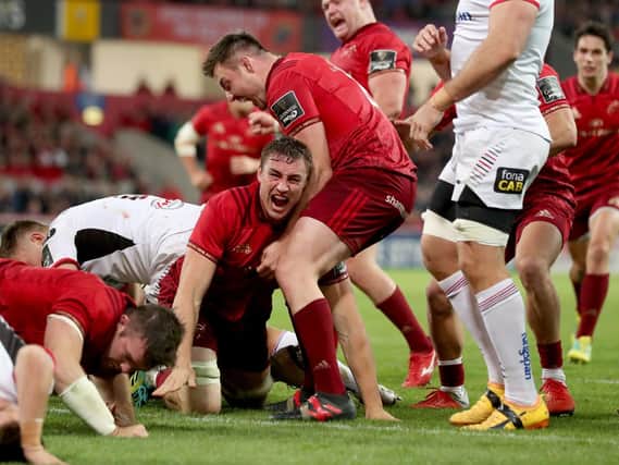 Munster celebrate one of their nine tries against Ulster