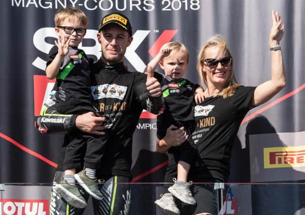Four-time World Superbike champion Jonathan Rea celebrates with his wife Tatia and children, Jake and Tyler on the podium at Magny-Cours in France