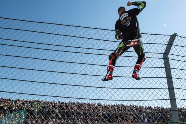 World champion Jonathan Rea celebrates in front of the fans at Magny-Cours in France on Saturday.