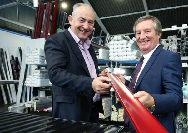 Peter Doherty, MD of Garage Doors pictured, left, at the Ballymena firm with Invest NI director Bill Montgomery