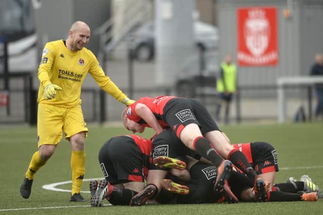 Crusaders players surround Jordan Forsythe after he scored from the half way line.  Credit: Stephen Hamilton -Inpho