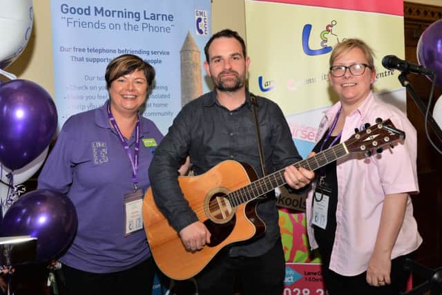 Thomas Hamilton from the Music Yard provided the entertainment at the launch of the Link Project and is pictured with Catherine McCallion, volunteer at Larne Community Care Centre and project manager, Barbara Ann Gilcrist. INLT 40-003-PSB