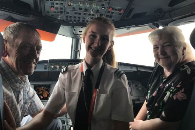 Alex with her grandparents in the cockpit