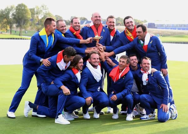 Team Europe celebrates after regaining the Ryder Cup on Sunday