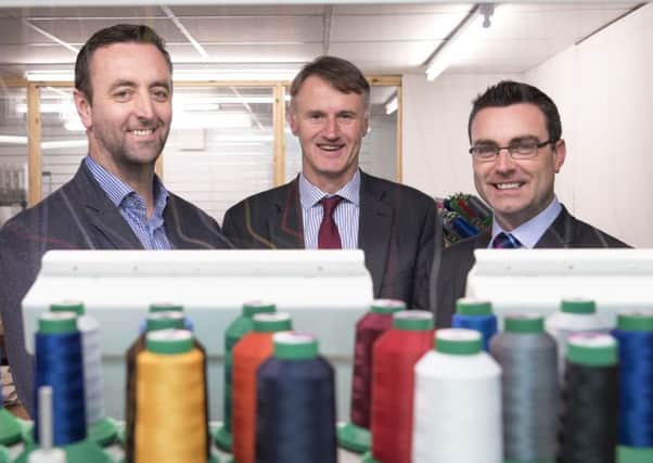 Padraic McKeever, owner of Sports Merchandising Ireland, left, with William McCulla, director of Corporate Finance at Invest NI and Neil McCabe, senior investment manager, WhiteRock Capital Partners