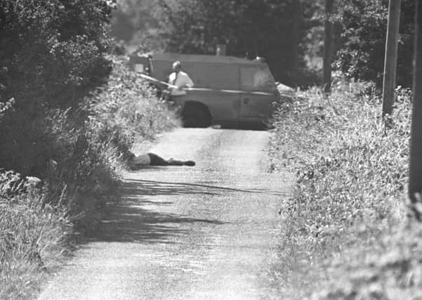 Around 70 alleged agents were identified and shot dead by brutal men in horrible circumstances, then ditched to dehumanise them. Above, the body of Brian McNally, an alleged IRA informer from Warrenpoint, killed and dumped on the border in 1984. Picture Pacemaker