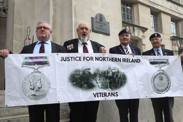 Veterans (left to right) Alan Barry, Roy Brinkley, Michael Burke and Peter White protesting outside the Ministry of Defence in Whitehall, London, against investigations into troops who fought in during the Troubles in Northern Ireland.