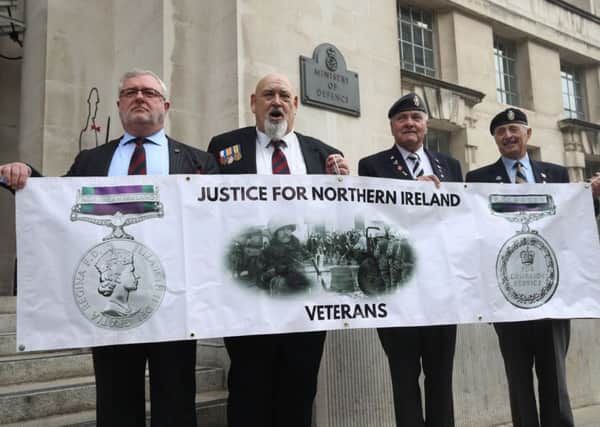 Veterans (left to right) Alan Barry, Roy Brinkley, Michael Burke and Peter White protesting outside the Ministry of Defence in Whitehall, London, against investigations into troops who fought in during the Troubles in Northern Ireland.