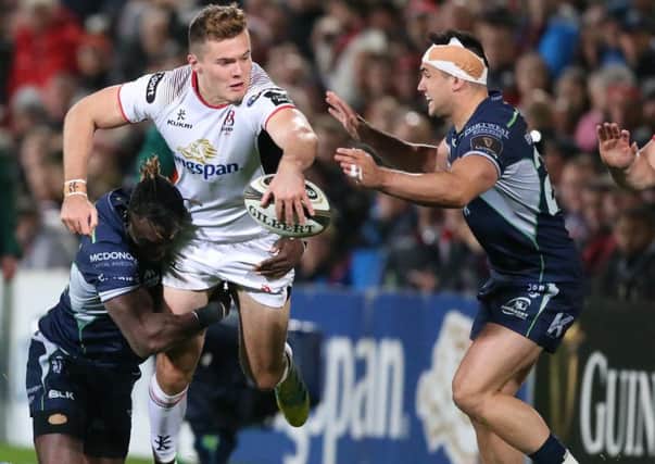 Ulster's Jacob Stockdale tackled by Connacht's  Niyi Adeolokun and  Cian Kelleher
