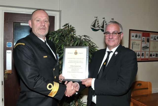 Billy Esler, who retired from Larne Coastguard Team, receives a certificate in recognition of his servive from Peter Mizen, Head of Coastguard Coastal Operations. INLT 39-203-AM