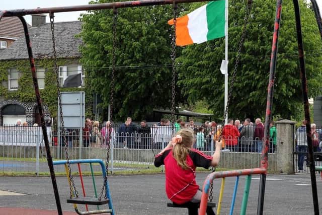 Supporters attend a republican gathering at Raymond McCreesh play park in May of this year