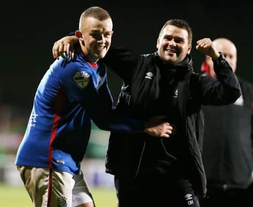 Linfield manager David Healy celebrates  with goal scorer Michael O'Connor after  a 1-0 victory against Glentoran at the final whistle  during Monday night's 'Big Two' Derby at tHe Oval.
Picture by Brian Little