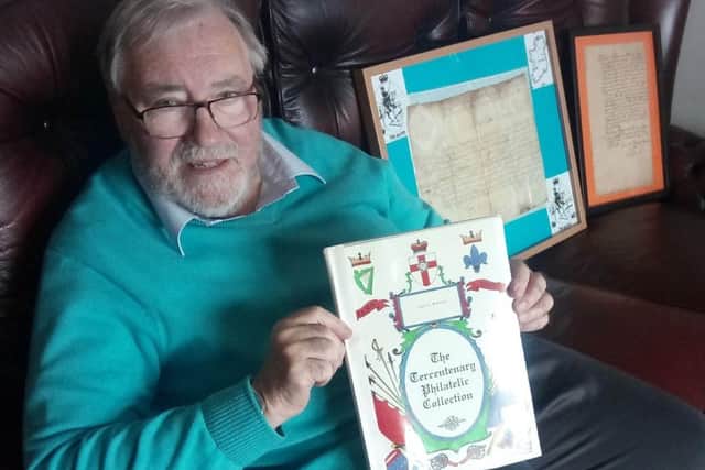 Robert McAuley with his Tercentenary Collection of first day covers which commemorates 14 of King Williams battles in Ireland. In the background are two signed letters from King William and the Duke of Leinster, Meinhardt Schomberg