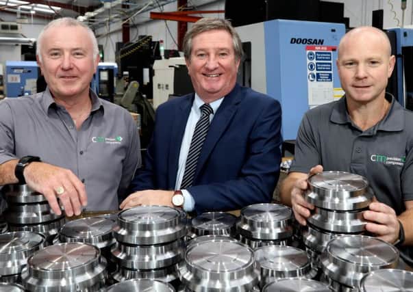 Pictured at the opening of CM Precision Components new factory is managing director Kieran Cooper, left and director Sean McLaughlin with Bill Montgomery, centre, executive director with Invest NI