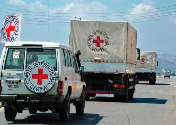 A convoy for the International Committee of the Red Cross (ICRC) in southern Lebanon, 2006, delivering relief aid supplies. (AP Photo/Lotfallah Daher)