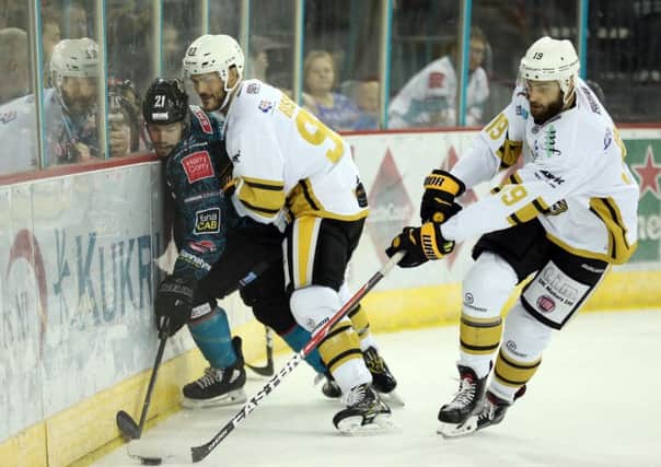 Belfast Giants' Francis Beauvillier against Nottingham Panthers' Jaynen Riesling and Robert Farmer