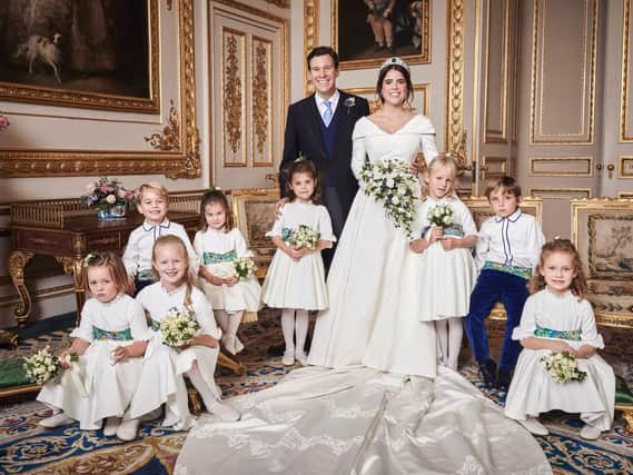This official wedding photograph released by the Royal Communications of Princess Eugenie and Jack Brooksbank in the White Drawing Room, Windsor Castle with (left to right) Back row: His Royal Highness Prince George of Cambridge; Her Royal Highness Princess Charlotte of Cambridge; Miss Theodora Williams; Miss Isla Phillips; Master Louis De Givenchy Front row: Miss Mia Tindall; Miss Savannah Phillips; Miss Maud Windsor.