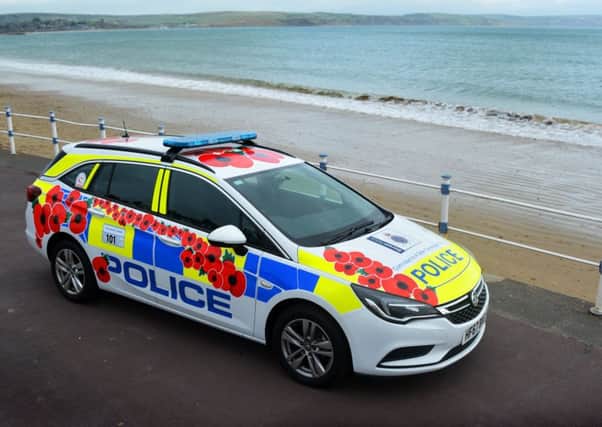 Image of poppy-liveried police car in 2017. Taken from Dorset Police website