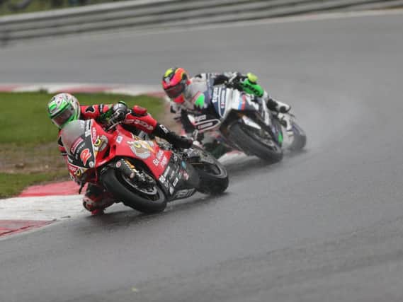 Glenn Irwin (PBM Be Wiser Ducati) leads Michael Laverty (Tyco BMW) in the wet at Brands Hatch.
