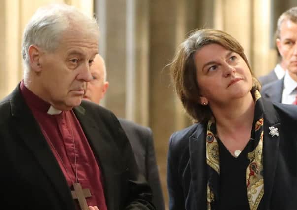 DUP leader Arlene Foster is given a tour of  St Patrick's Cathedral in Dublin by Church of Ireland Archbishop of Dublin and Bishop of Glendalough, Michael Jackson.