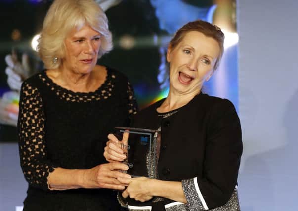 The Duchess of Cornwall (left) and Anna Burns on stage at the Guildhall in London after she was awarded the Man Booker Prize for Fiction for her novel Milkman. Photo: Frank Augstein/PA Wire