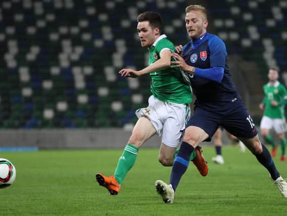 Paul Smyth and Slovakia's Michal Siplak during this Tuesday evening's game at the National Stadium, Belfast. Photo by David Maginnis/Pacemaker Press