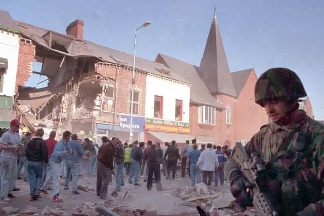 A soldier stands on guard in the aftermath of the 1993 Shankill Bomb in Belfast in 1993. Photo: Pacemaker