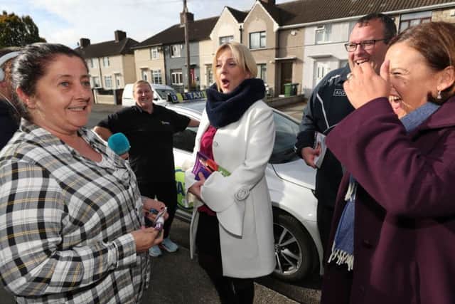 Sinn Fein Leader Mary Lou McDonald (right) and Sinn Fein's Presidential Candidate Liadh Ni Riada (centre) talk to members of the public whilst canvasing in the Cabra area of Dublin. Pic: Niall Carson/PA Wire