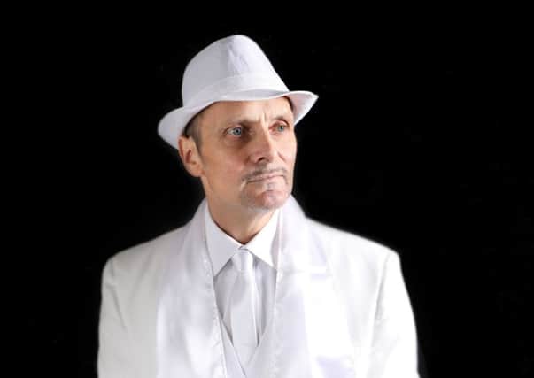 An image of Colin Nevin taken by Sonia Lilley this autumn to promote his upcoming The Man in White talk; Mr Nevin said the white suit is a reference to a Johnny Cash cash song of the same name, and to forgiveness
