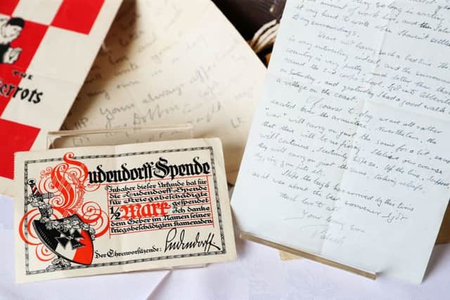 A letter written on Armistice Day alongside a 'Ludendorff Fund for Disabled Ex-Servicemen receipt' which was among material relating to the Dixon family of Dublin that has been discovered in a suitcase by the Belfast Charitable Society/Clifton House. Pic by Brian Lawless/PA Wire