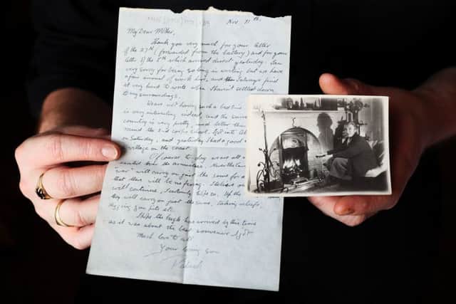 A letter written by Patrick Dixon to his mother on Armistice Day along with a photograph of his mother Margaret Kerr Dixon, which were among material relating to the Dixon family of Dublin that has been discovered in a suitcase by the Belfast Charitable Society/Clifton House. Pic by Brian Lawless/PA Wire