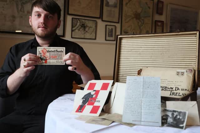 Aaron McIntyre, archive and heritage development officer, holds a 'Ludendorff Fund for Disabled Ex-Servicemen receipt' which was among material relating to the Dixon family of Dublin that has been discovered in a suitcase by the Belfast Charitable Society/Clifton House. Pic by Brian Lawless/PA Wire