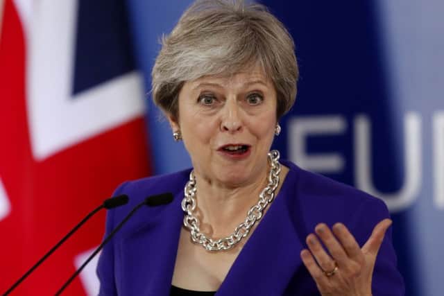 Theresa May during her press conference in Brussels