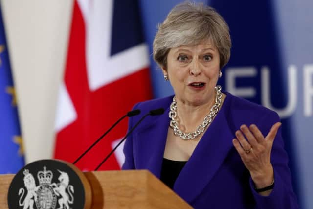 British Prime Minister Theresa May speaks during a media conference at an EU summit in Brussels. (AP Photo/Alastair Grant)