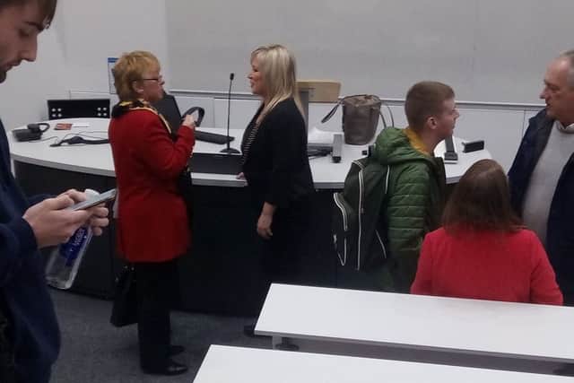 At the Peter Froggatt centre at Queen's University, Michelle O'Neill, northern leader of Sinn Fein, speaks to Anne Graham, left, wearing red. Anne, who had earlier asked a question from the audience after Ms O'Neill gave a talk on Wednesday October 18 2018, is the sister of the murdered lawyer Edgar, who was shot dead at the edge of the university by the IRA in 1983