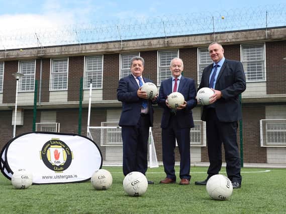Maghaberry Prison has teamed up with Ulster GAA to coach skills for Gaelic football to prisoners as part of a sports rehabilitation initiative. 20-prisoners have taken part in the GAA Foundation Award course in which they were coached in skills and rules for football. Pictured (left-right) are Ronnie Armour, Director General of the Northern Ireland Prison Service, Michael Hasson, President Ulster GAA, and David Kennedy, Maghaberry Prison Governor. Picture: Michael Cooper