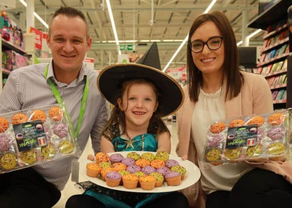 Layla Rea, 6, with Steven Henry, Asda Enniskillen store manager and Catherine Dorrity, product manager of Scotts Bakery, Fivemiletown