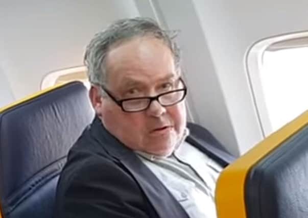 MANDATORY CREDIT: David Lawrence

Still from handout video dated 19/10/18 of a passenger on Ryanair flight FR015 from Barcelona to London Stansted who launched a racist tirade against the woman in the seat next to him