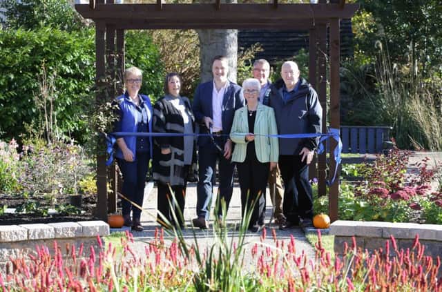 Pictured are (l-r) Barbara Kelso, garden designer; Geraldine Gilpin, chief executive, Abbeyfield & Wesley Housing Association; David Maxwell, BBC Radio Ulster Gardener's Corner presenter; Mrs Lily Gault, who has been a resident at Wesley Court since the scheme opened 22 years ago; Joe McKnight, chair, Abbeyfield & Wesley Housing Association; and William McCone, Wesley Court resident. Photos: Kelvin Boyes / Press Eye