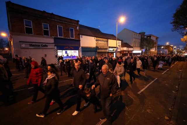 Hundreds of people 'Walk to Remember' those killed in five terrorist bombings on the Shankill Road during The Troubles. Niall Carson/PA Wire