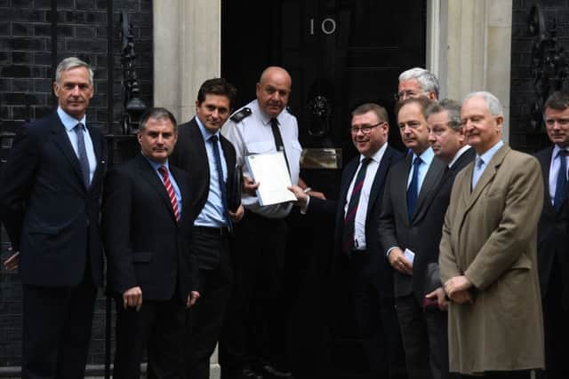 MPs at Downing Street to deliver the petition to Prime Minister Theresa May