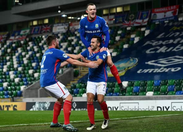 Andy Waterworth scores during Tuesday evening's game at Windsor park in Belfast.
Photo Colm Lenaghan/Pacemaker Press