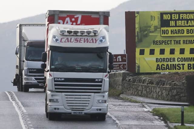 A truck passes a Brexit billboard in Jonesborough, Co. Armagh, on the northern side of the border between Northern Ireland and the Republic of Ireland, as Prime Minister Theresa May has said keeping the common travel area between the UK and Republic of Ireland will be a priority in EU divorce talks. PRESS ASSOCIATION Photo. Picture date: Tuesday January 17, 2017. See PA story POLITICS Brexit Ireland. Photo credit should read: Niall Carson/PA Wire
