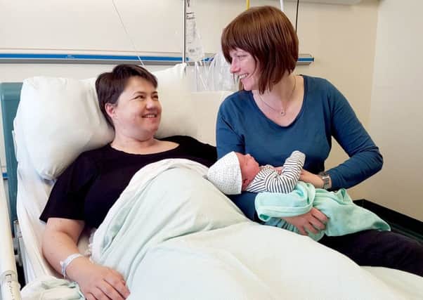 Ruth Davidson and her partner Jen Wilson with baby Finn. Pic: Scottish Conservatives/PA Wire
