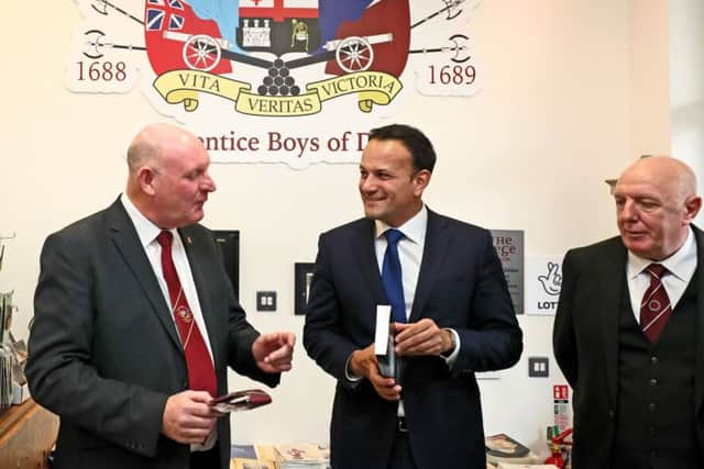 Taoiseach Leo Varadkar (centre) with General Secretary of the Apprentice Boys of Derry William Moore (left) during a visit to the association's memorial hall in Londonderry. Pic: Brian Lawless/PA Wire