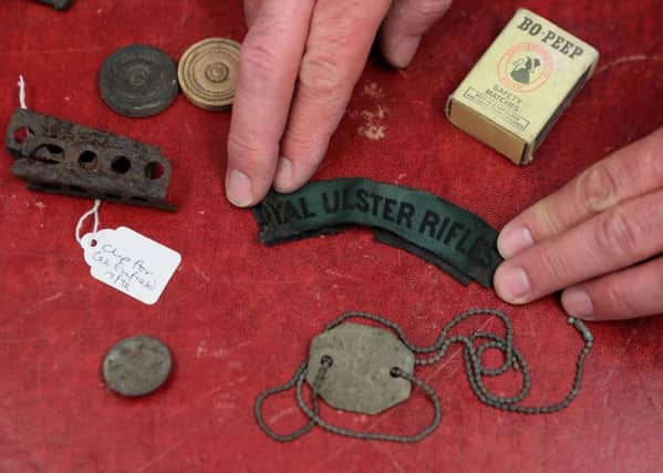 Michael King, Heritage Manager at the Down County Museum, with some of the artifacts believed to date back to the First World War which have been found at an army camp in Co Down. The discoveries were made after more than 30 huts, originally built in 1915, were removed from Ballykinler. PRESS ASSOCIATION Photo. Picture date: Wednesday October 17, 2018. See PA story MEMORIAL Armistice Hut. Photo credit should read: Brian Lawless/PA Wire