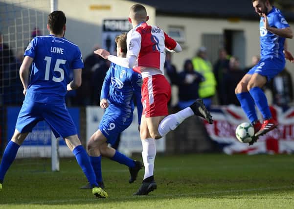 Jake Dykes' own goal left it level for Linfield against Dungannon Swifts. Pic by Pacemaker.